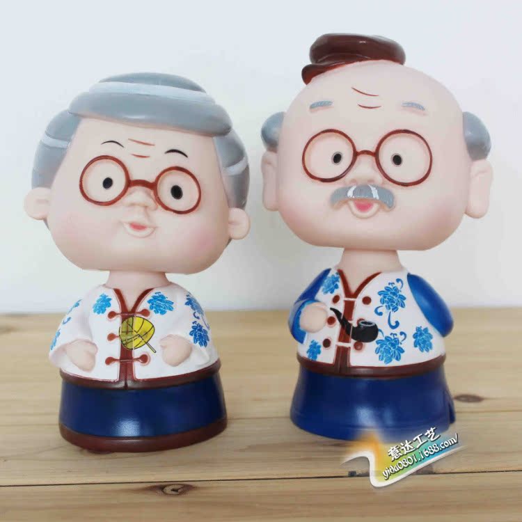 家居生活礼物 商品编号:661a 商品名称:钱罐批发 摇头公仔恩爱老公公