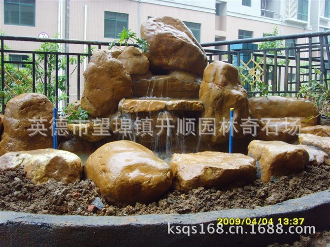 专业设计、制造大小黄腊石假山、黄蜡石鱼池水景