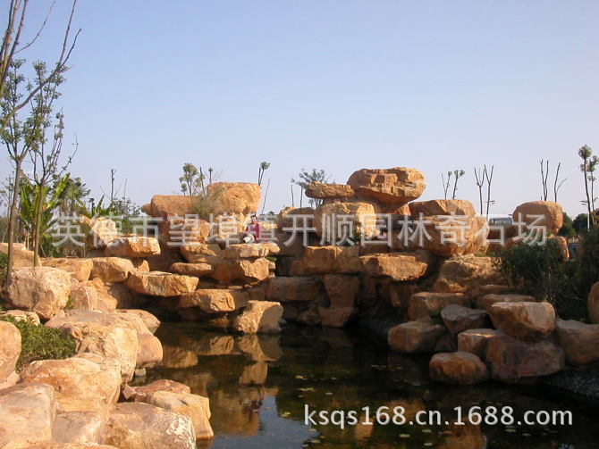 专业设计、制造大小黄腊石假山、黄蜡石鱼池水景