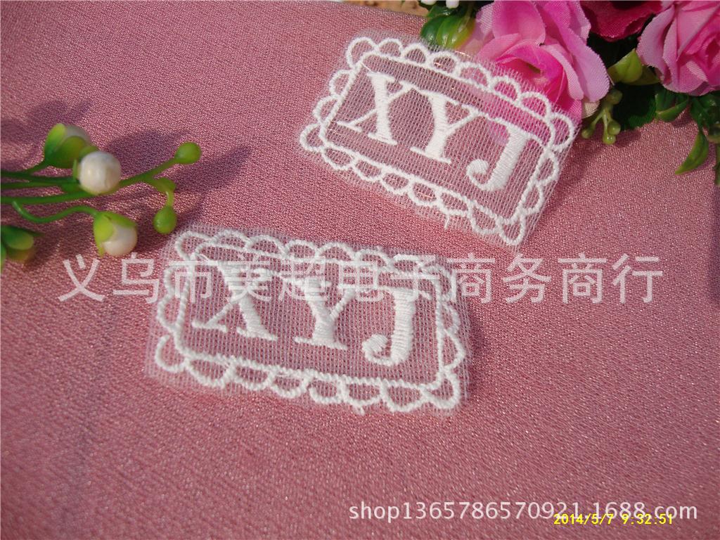 花边-2014年新款长方形英文商标、棉线网布刺