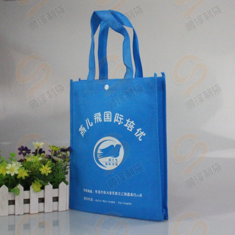 【蓝色高档学生专用手提袋 带纽扣手提无纺布