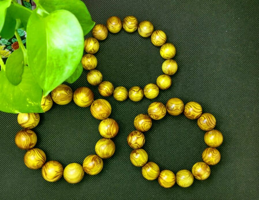 天然海南黄楠木手串 极品鬼脸双眼金丝楠护主转运佛珠手链 工艺品