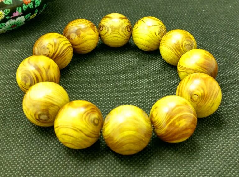 天然海南黄楠木手串 鬼脸双眼金丝楠护主转运佛珠手链 工艺品